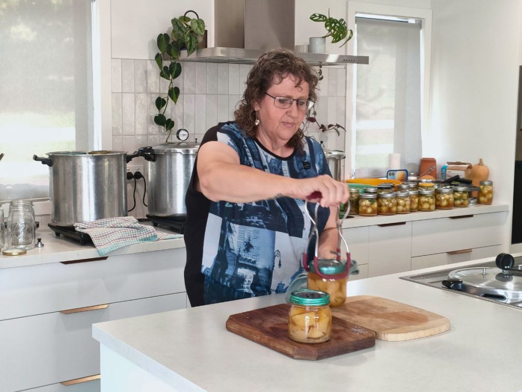 katherine unloading a presto pressure canning in our online canning course